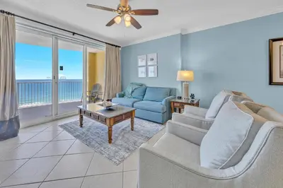 a living room with a couch and a table at Emerald Isle 1504 in Panama City Beach
