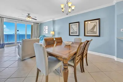 a dining room with a table and chairs at Emerald Isle 1504 in Panama City Beach