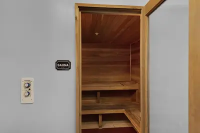 a closet with wooden shelves in a room at Emerald Isle 1504 in Panama City Beach