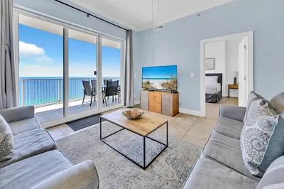 a living room with a couch and a table at Ocean Villa 2004 by Emerald Coast Retreats Unit in Panama City Beach