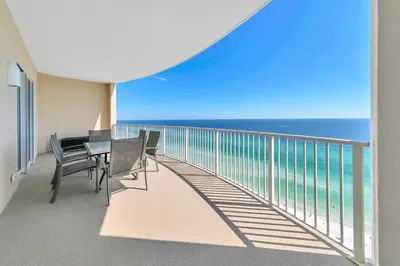 a balcony with a table and chairs and the ocean at Ocean Villa 2004 by Emerald Coast Retreats Unit in Panama City Beach