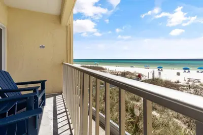 a balcony with a view of the beach at K and J Panama City Beach in Panama City Beach