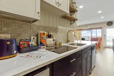 a kitchen with a sink and a counter top at K and J Panama City Beach in Panama City Beach
