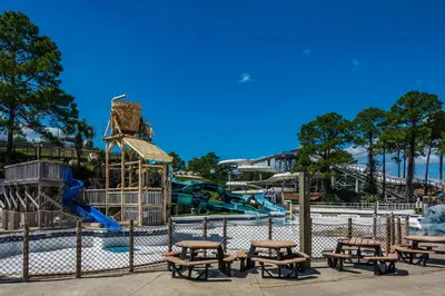 a park with a playground with benches and slides at Tidewater 1005 in Panama City Beach