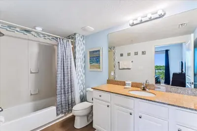 a bathroom with a sink and a toilet and a shower at 601 Grandview East in Panama City Beach