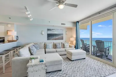 a living room with a couch and a table at 930 Shores Of Panama in Panama City Beach