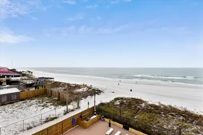 an aerial view of a beach with the ocean at 203 Moondrifter in Panama City Beach