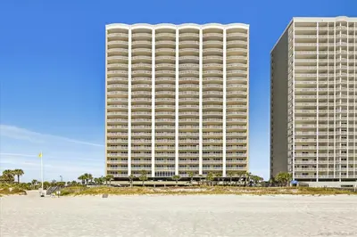 a large building with a beach in front of it at 2102 Ocean Villa in Panama City Beach