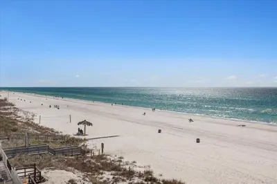 a beach with a lot of people and the ocean at 305 Marisol in Panama City Beach