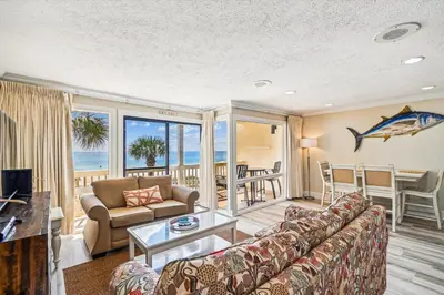 a living room with a couch and a table at #17 Latitude 29 in Panama City Beach