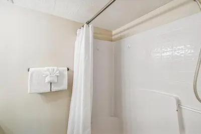a bathroom with a shower with a shower curtain at #17 Latitude 29 in Panama City Beach