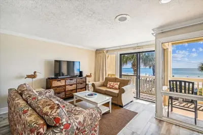 a living room with a couch and a television at #17 Latitude 29 in Panama City Beach