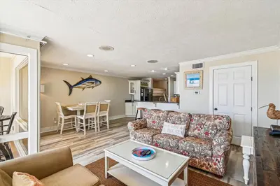 a living room with a couch and a table at #17 Latitude 29 in Panama City Beach