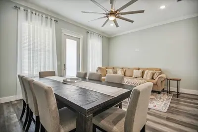a dining room with a table and a couch at Starfish Shores in Panama City Beach