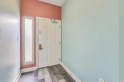 an empty room with a door and a window at 225-Shores Of Panama in Panama City Beach