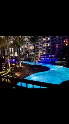 a large swimming pool in a city at night at 225-Shores Of Panama in Panama City Beach