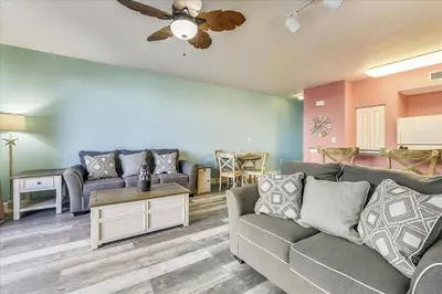 a living room with a couch and a table at 225-Shores Of Panama in Panama City Beach