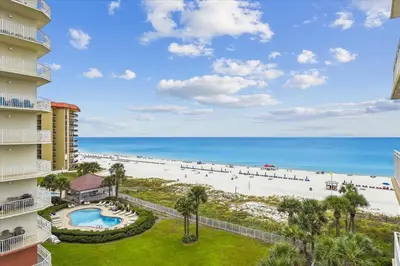 a view of the beach from the balcony of a resort at 701 Sterling Beach in Panama City Beach