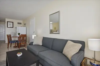 a living room with a couch and a table at 721 Top Of The Gulf in Panama City Beach
