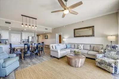 a living room with a couch and a table at 302 Sterling Beach in Panama City Beach