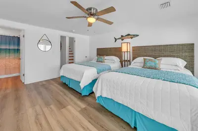 a bedroom with two beds and a ceiling fan at Largo Mar 106 by Emerald Coast Retreats in Panama City Beach