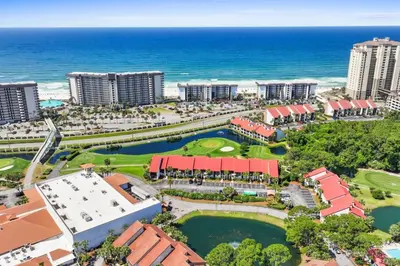 an aerial view of a resort near the ocean at Edgewater Golf Villa 605 in Panama City Beach