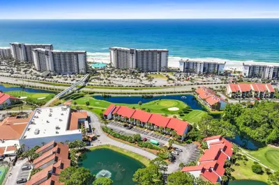 an aerial view of a resort near the ocean at Edgewater Golf Villa 605 in Panama City Beach