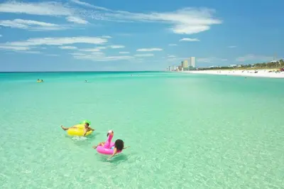 two children playing in the water at the beach at Southwinds Unit D3 in Panama City Beach