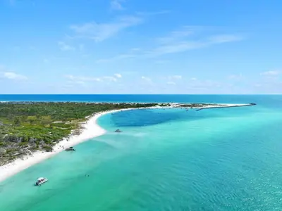 an island in the ocean with two boats in the water at Southwinds Unit D3 in Panama City Beach
