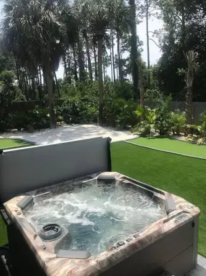 a jacuzziificialificialificialificialificialificialificialificialificialificialificial at Tropical Oasis, Tiki Bar, Pool, Mini Golf, Hot Tub in Panama City Beach