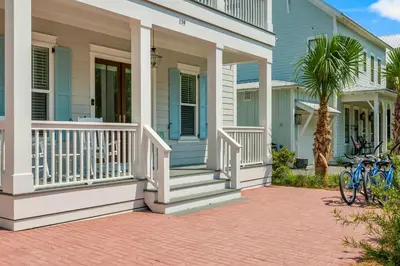 a blue house with bikes parked outside of it at Cottages at Eastern Lake by Panhandle Getaways in Santa Rosa Beach