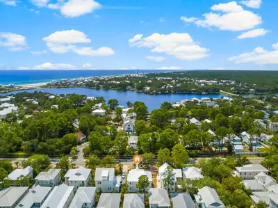 an aerial view of a town with a body of water at Cottages at Eastern Lake by Panhandle Getaways in Santa Rosa Beach