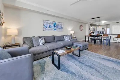 a living room with a couch and a table at Tidewater 1802 in Panama City Beach