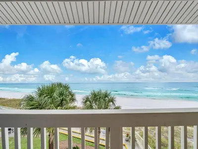 a view of the beach from the balcony of a beach house at Latitude 29 #36 in Panama City Beach