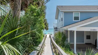 a house on the beach next to the ocean at Bahama West by Panhandle Getaways in Panama City Beach