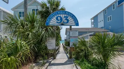 a sign for a hotel on the beach at Bahama West by Panhandle Getaways in Panama City Beach