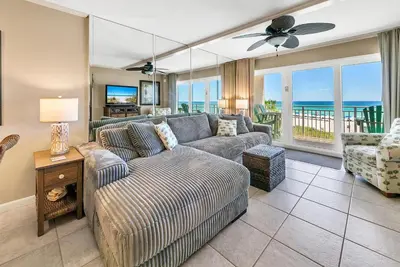 a living room with a couch and a table at Dunes of Panama 205D in Panama City Beach