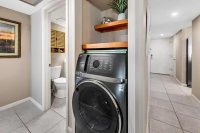 a laundry room with a washer and dryer at Dunes of Panama 205D in Panama City Beach