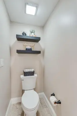 a bathroom with a white toilet in a room at Newly Renovated Luxury OCEAN FRONT Condo! Top Floor Condo with PENTHOUSE OCEAN VIEWS! in Panama City Beach