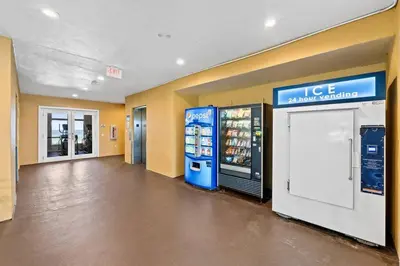 a convenience store aisle with a large drink vending machine at Coral Charm in Panama City Beach