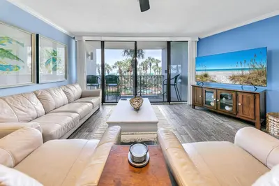 a living room with a couch and a table at Edgewater Tower 1-105 in Panama City Beach