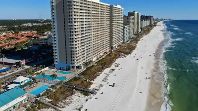 an aerial view of a beach and buildings at Gulf Highlands #175 by Nautical Properties in Panama City Beach