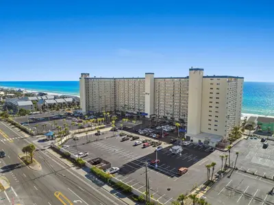 an aerial view of a parking lot next to the ocean at Deep Savings While Regency Updates Oct-March in Panama City Beach