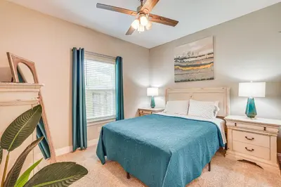 a bedroom with a bed and a ceiling fan at Family-Friendly Panama City Home Less Than 1 Mi to Beach in Panama City