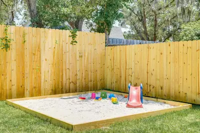 a sandbox in front of a wooden fence at Family-Friendly Panama City Home Less Than 1 Mi to Beach in Panama City