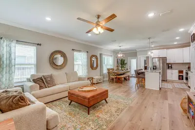 a living room with a couch and a table at Family-Friendly Panama City Home Less Than 1 Mi to Beach in Panama City