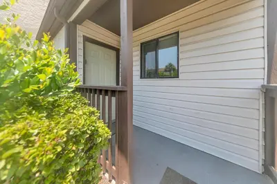 a front porch of a house with a window at Portside P1 in Panama City Beach