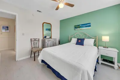 a bedroom with a bed and a ceiling fan at Portside P1 in Panama City Beach