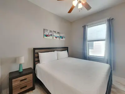 a bedroom with a bed and a ceiling fan at Prominence North #54A - Barefoot Bungalow in Inlet Beach