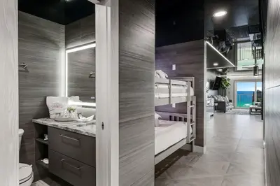a bathroom with two bunk beds in a room at The Summit 1001 in Panama City Beach